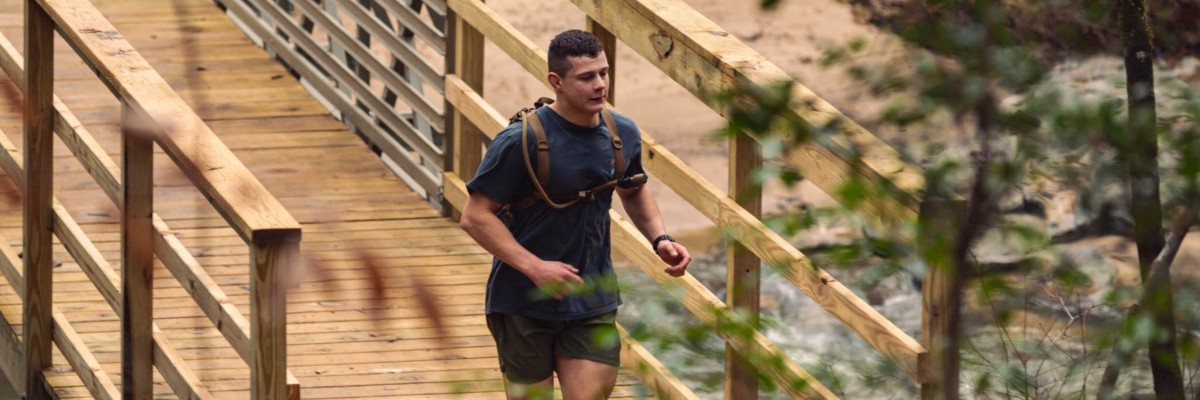 Trail runner crossing a bridge at One Epic Run