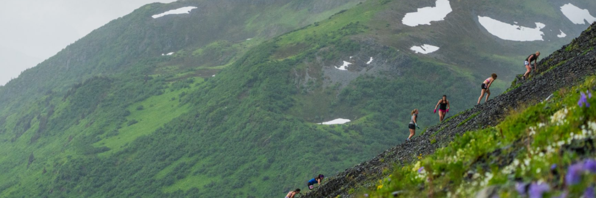 Racers ascending Mount Marathon in the mist.