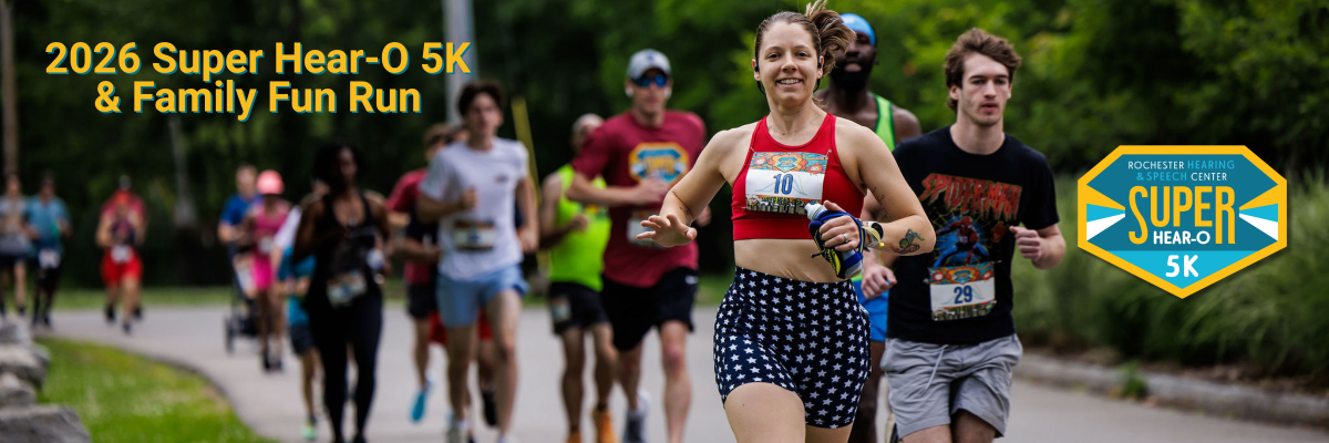 A group of runners participating in a 5K race through a park
