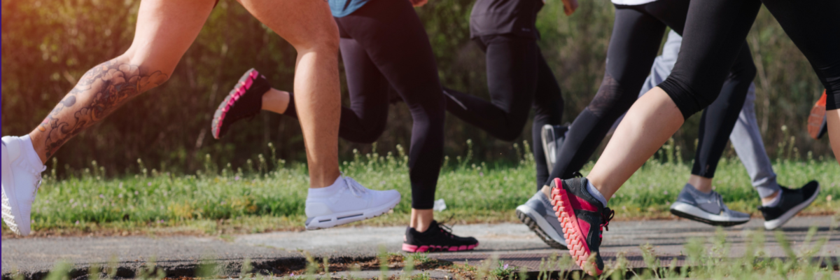 Group of people running on a trail
