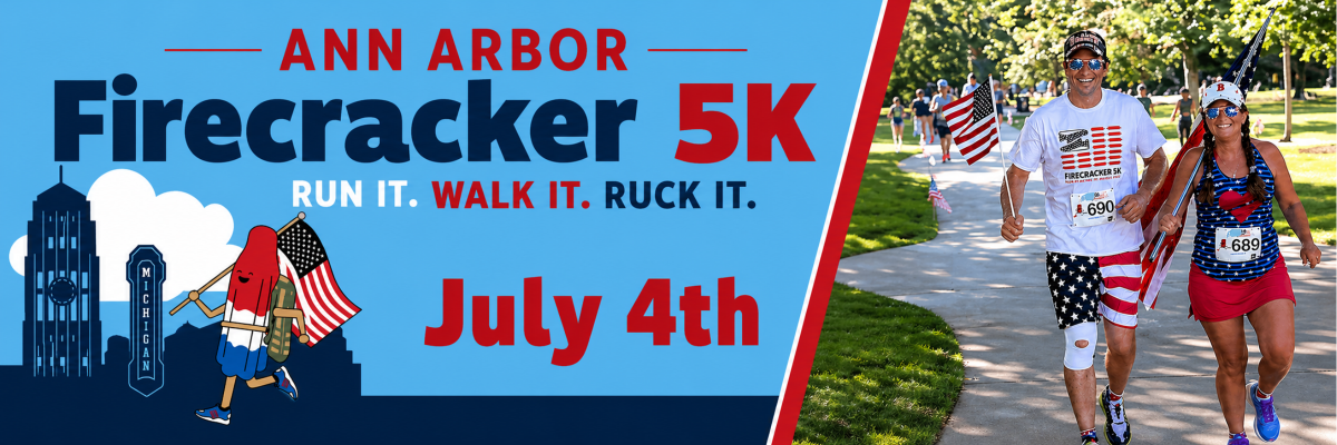 Picture of two runners decked out in red, white, and blue and carrying American flags