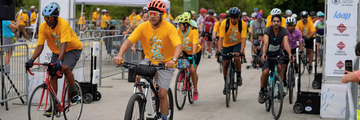 People riding bikes at finish line.